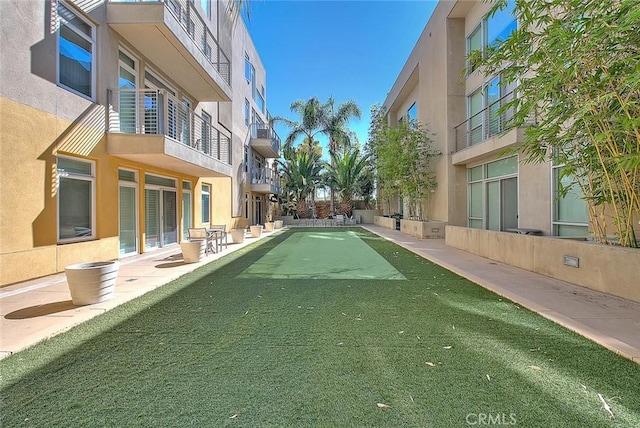 view of community featuring a residential view and a patio