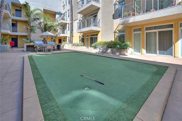 view of swimming pool with a patio area