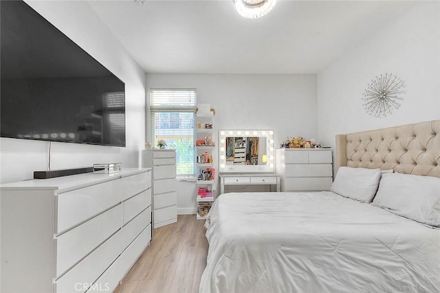 bedroom with light wood-style floors