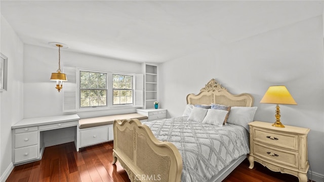 bedroom featuring dark hardwood / wood-style flooring