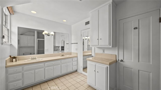 bathroom with tile patterned flooring and vanity