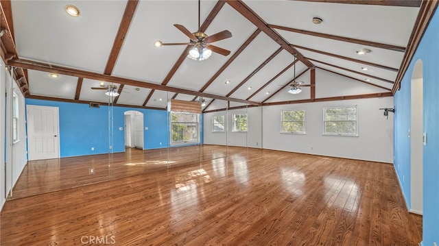 interior space featuring ceiling fan, beamed ceiling, high vaulted ceiling, and hardwood / wood-style flooring