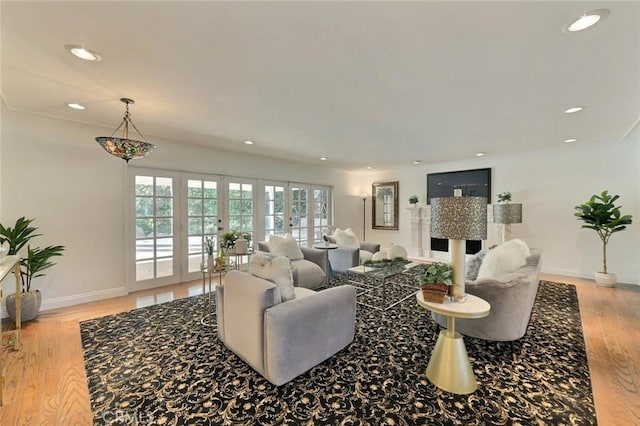 living room with french doors and light hardwood / wood-style floors