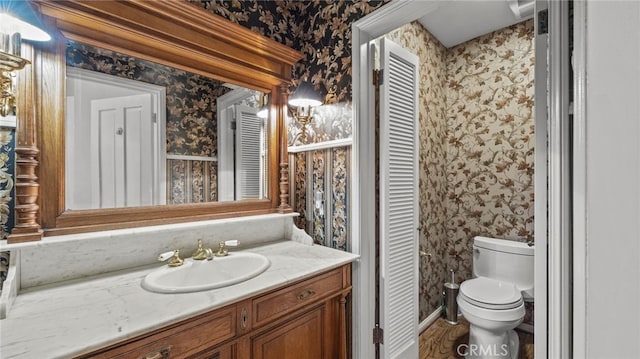 bathroom with vanity and toilet