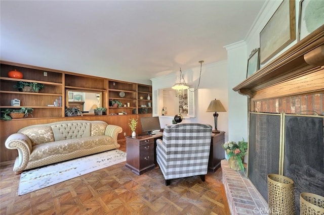 living room featuring dark parquet flooring, built in features, and ornamental molding