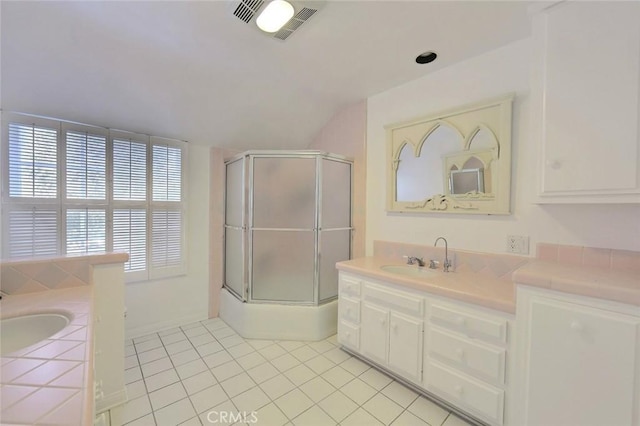 bathroom with shower / bath combination with glass door, vanity, tile patterned floors, and vaulted ceiling