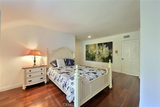 bedroom featuring dark hardwood / wood-style flooring