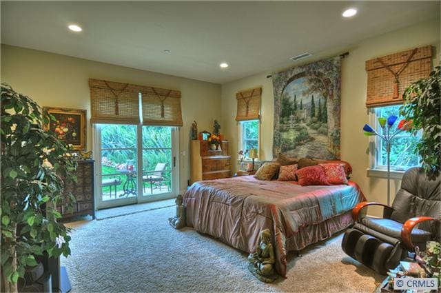 carpeted bedroom featuring access to exterior