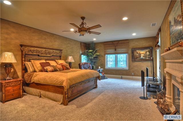 carpeted bedroom with ceiling fan