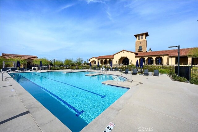 view of swimming pool with a patio area