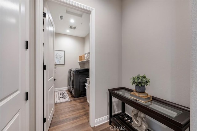 24185 Sprout Dr, Corona, CA 92883 - laundry area featuring baseboards, washer and dryer, wood finished floors, and laundry area