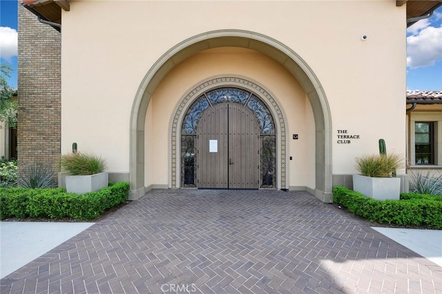 24185 Sprout Dr, Corona, CA 92883 - doorway to property with driveway and stucco siding