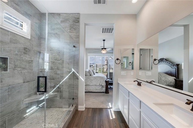 24185 Sprout Dr, Corona, CA 92883 - bathroom with a stall shower, a sink, wood finished floors, and ensuite bath