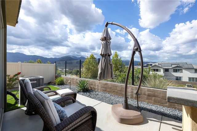 view of patio / terrace featuring a mountain view