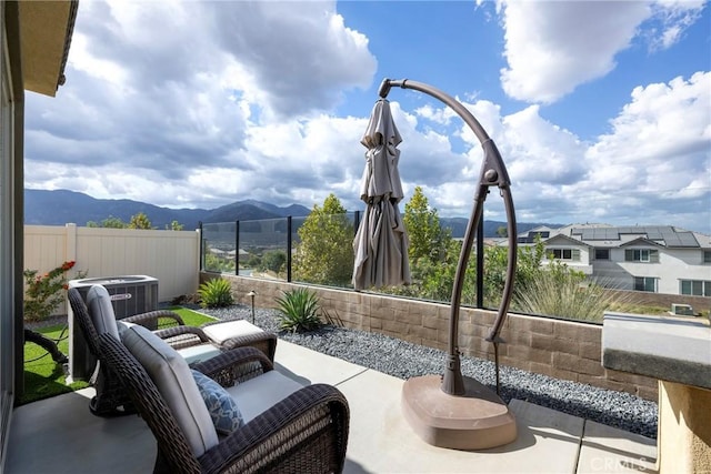 24185 Sprout Dr, Corona, CA 92883 - view of patio featuring fence and a mountain view