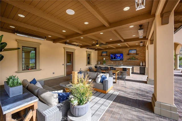 view of patio featuring an outdoor hangout area and ceiling fan