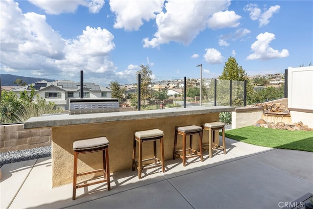 view of patio with a bar