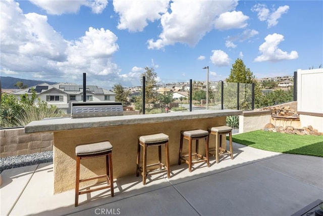 24185 Sprout Dr, Corona, CA 92883 - view of patio / terrace featuring a residential view, outdoor dry bar, and fence