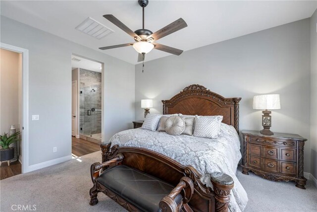 carpeted bedroom featuring ceiling fan and connected bathroom