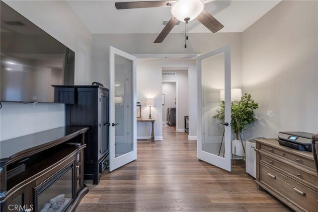 24185 Sprout Dr, Corona, CA 92883 - interior space featuring visible vents, baseboards, ceiling fan, wood finished floors, and french doors