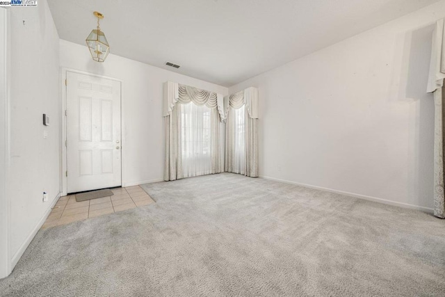 empty room with light colored carpet