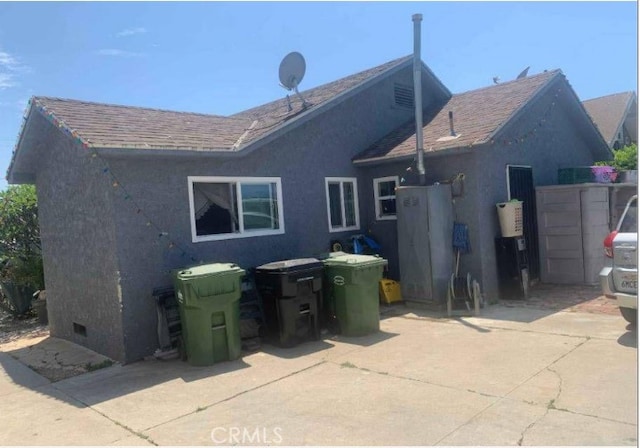 back of house with a patio area