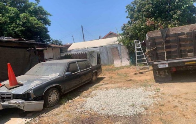 exterior space featuring an outbuilding