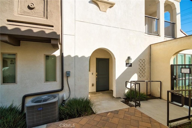 entrance to property featuring central AC