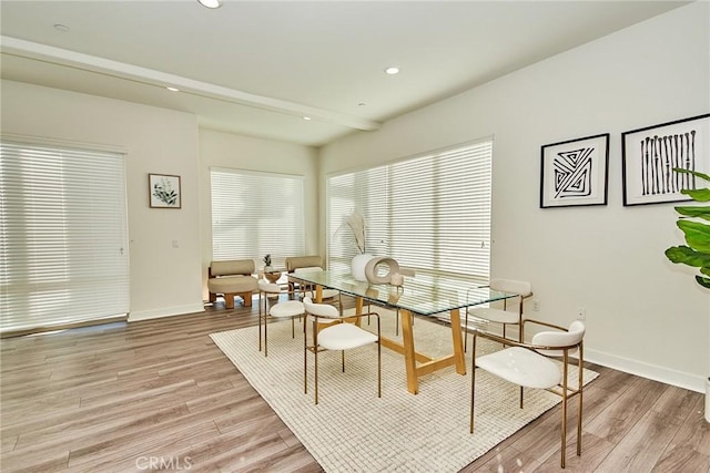 dining space featuring light wood-type flooring