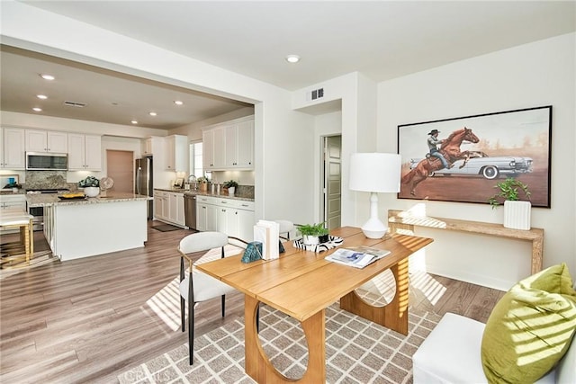 dining area featuring light hardwood / wood-style floors