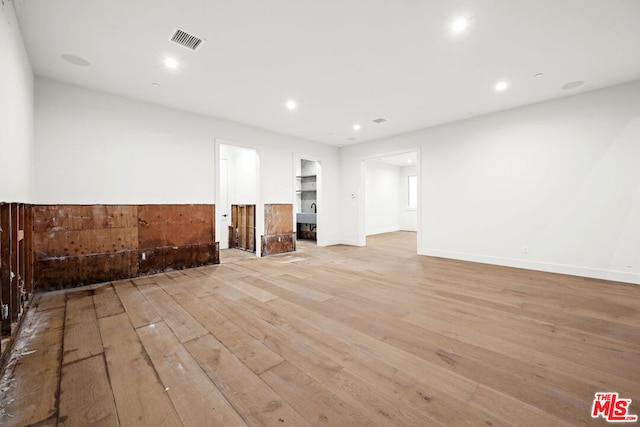 unfurnished living room with light hardwood / wood-style floors