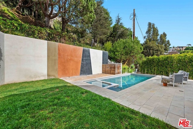 view of pool featuring a lawn and a patio area