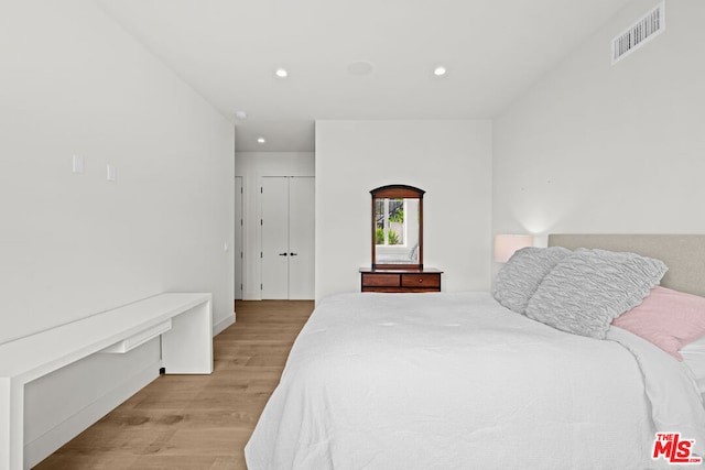 bedroom with light hardwood / wood-style flooring