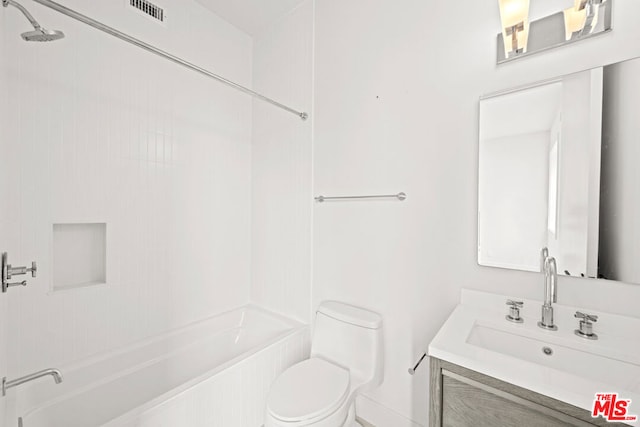 full bathroom with toilet, tiled shower / bath combo, and vanity