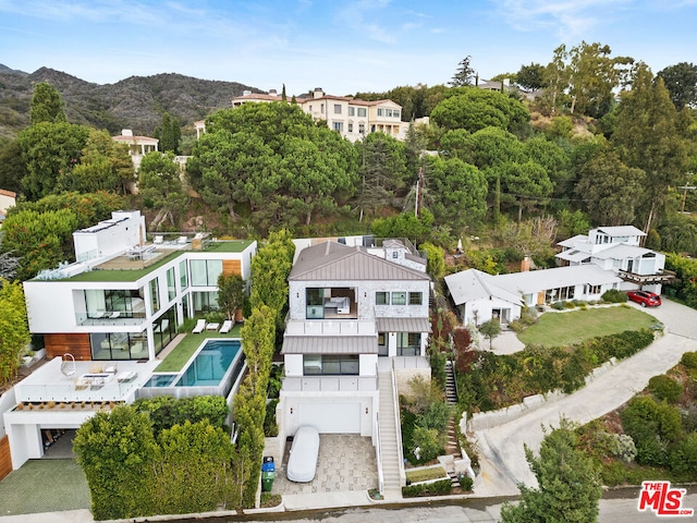 birds eye view of property with a mountain view