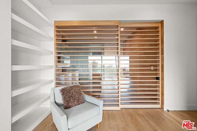 sitting room featuring wood-type flooring