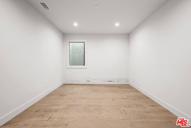 empty room with light hardwood / wood-style floors