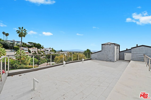 view of patio with a storage unit