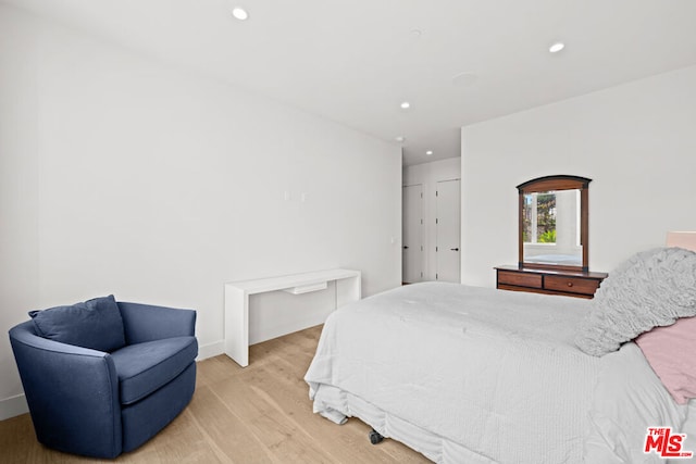 bedroom featuring light wood-type flooring