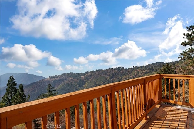 wooden terrace with a mountain view