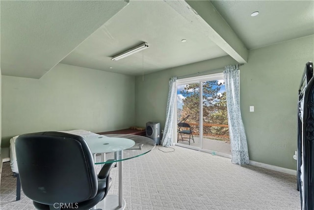 office area with carpet flooring and beamed ceiling