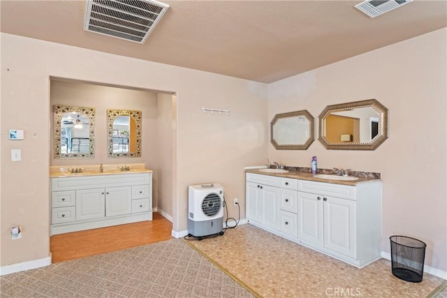 bathroom featuring hardwood / wood-style floors and vanity