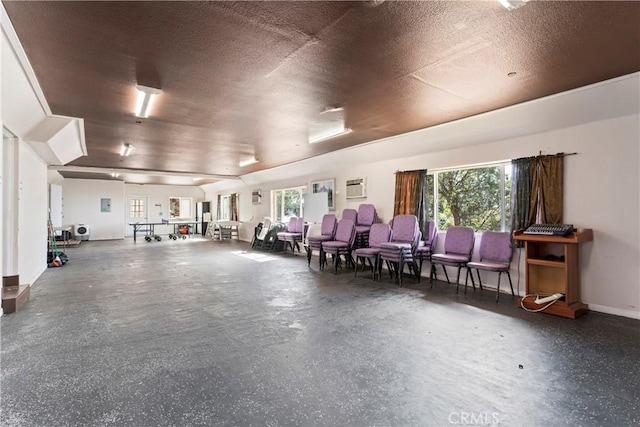 interior space featuring a healthy amount of sunlight and a textured ceiling