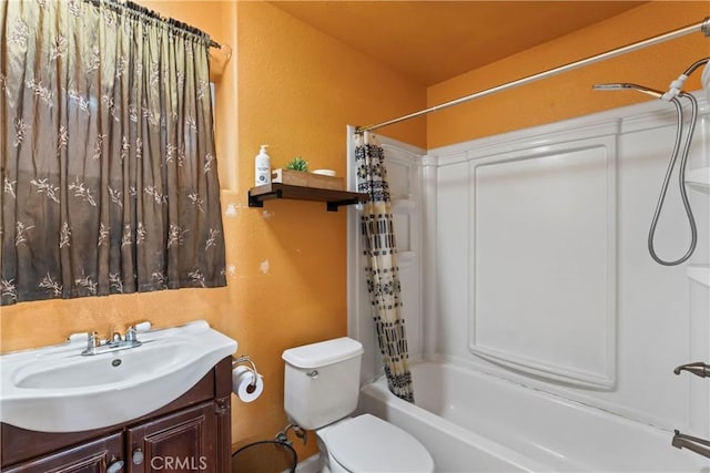 full bathroom featuring shower / tub combo, vanity, and toilet