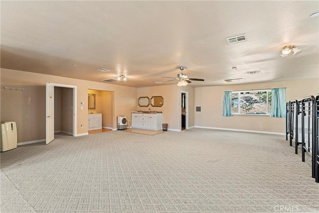 unfurnished living room featuring ceiling fan, radiator heating unit, and carpet