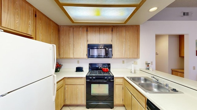 kitchen featuring black appliances, light tile patterned flooring, kitchen peninsula, and sink