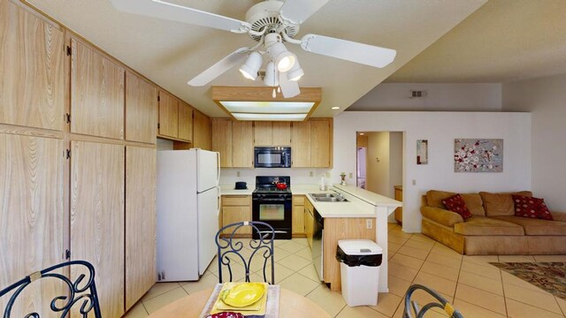 kitchen featuring kitchen peninsula, light brown cabinetry, and black appliances