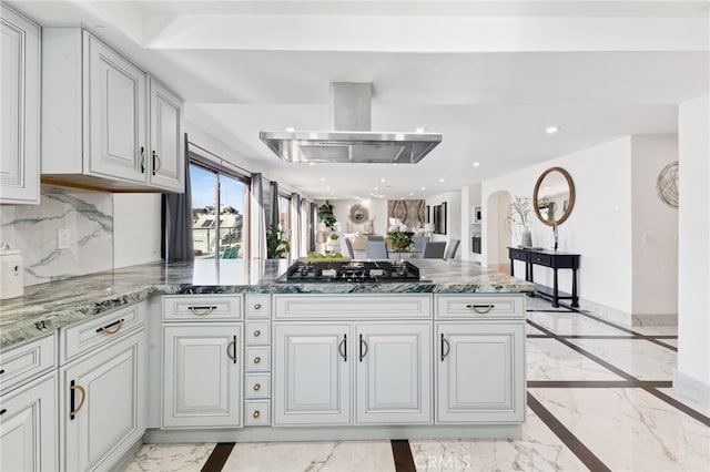 kitchen featuring kitchen peninsula, tasteful backsplash, black gas stovetop, ventilation hood, and stone counters