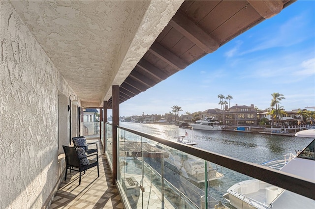 balcony featuring a water view