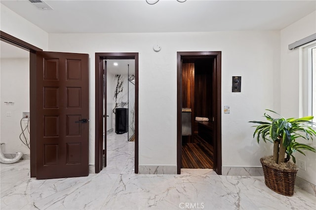 bedroom featuring a closet and ensuite bath